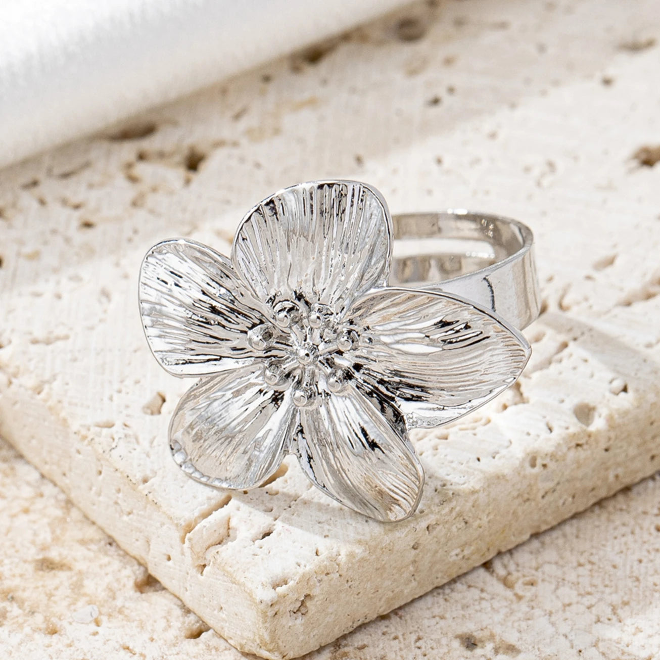 A Women's Ring with a Flower Design, Made of Metal and Adjustable in Size, Suitable for Everyday Wear and Holidays